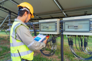 Man using solar panel electrical circuit.